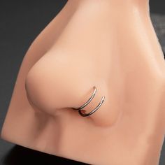 a close up of a ring on top of a mannequin head