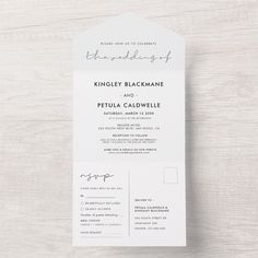 the wedding program is displayed on top of a white card with black ink and calligraphy