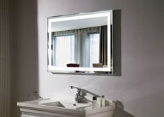 a bathroom sink with a mirror above it and a window in the backround