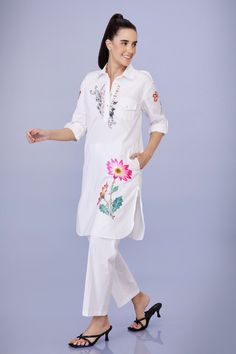 White rolled up sleeves collared pathani style tunic with aster flora cutwork and multi thread embroidery. Paired with a trouser. - Aza Fashions Summer Straight Kurta With Set-in Sleeves, Straight Kurta With Set-in Sleeves For Spring, Traditional Spring Kurta With Set-in Sleeves, Long Sleeve Kurta With Floral Embroidery For Work, Long Sleeve Floral Embroidery Kurta For Work, Spring Resham Embroidery Kurta For Workwear, Spring Workwear Kurta With Resham Embroidery, Workwear Straight Kurta With Set-in Sleeves, Traditional Spring Workwear Sets