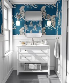 a bathroom with octopus wallpaper and blue walls