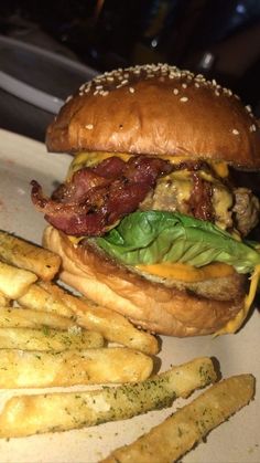 a hamburger and french fries on a plate