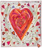 a quilted heart on a white background with red and pink hearts in the center