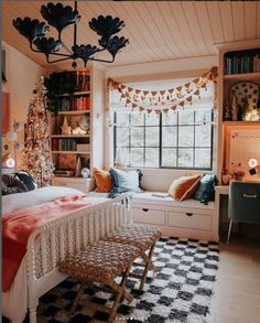 a bedroom decorated for christmas with lots of holiday decorations on the windowsill and shelves