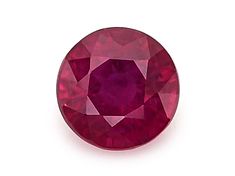 an oval cut ruby stone on a white background