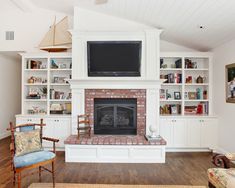 the living room is clean and ready for us to use it's fireplace as an entertainment center