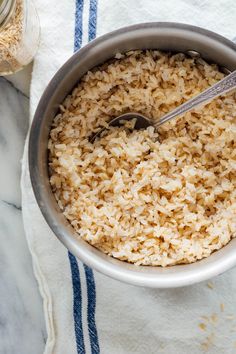 a bowl filled with rice on top of a table