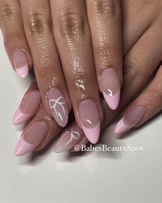 @BabesBeauty.Spot on IG  Coquette bow nails 🎀🌷✨ Shimmer French Tip Nails Almond, Pink Nails With Cute Design, Light Pink French Tip With Bow, Back To School Nails College, Nail Inspired Pink, Valentines Nails Oval Shape, French Nails With Bow Design, Pink Nails With White Bow, Pink Bows Nails