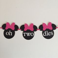 minnie mouse bunting banner with pink bows and oh two dies on white background