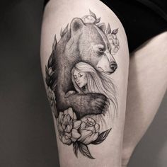 a woman and bear tattoo on the thigh