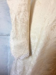 "60s 70s Ivory satin brocade wedding gown Low V back with long sleeves that have pearl buttons Satin floral design Puff sleeves Train Renaissance style Size Bust - 36\" Waist - 27.5\" Hips - 38\" Arm - 25\" Shoulder - 15\" Length Front - 53\" Length Train - 86\" Condition - Very Good Vintage slight fraying of the lace trim" Elegant Satin Victorian Wedding Dress, Fitted Beige Victorian Wedding Dress, Elegant Cream Victorian Dress For Wedding, Beige Fitted Victorian Wedding Dress, Vintage Victorian Satin Dress For Formal Occasions, Vintage Satin Victorian Dress For Formal Occasions, Fitted Cream Victorian Dress For Wedding, Silk Victorian Wedding Dress, Formal Vintage Victorian Satin Dress