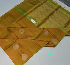 A beautiful dual tone pure silk kanjivaram Gold Designer Saree In Traditional Drape, Designer Gold Dupatta For Festivals, Designer Gold Saree For Festivals, Elegant Gold Traditional Wear, Silk Mark Certified, Elegant Gold Traditional Wear With Silk Mark, Elegant Traditional Wear In Raw Silk With Silk Mark, Elegant Katan Silk Traditional Wear, Silk Mark Certified, Elegant Traditional Katan Silk Wear With Silk Mark, Elegant Traditional Wear In Katan Silk With Silk Mark