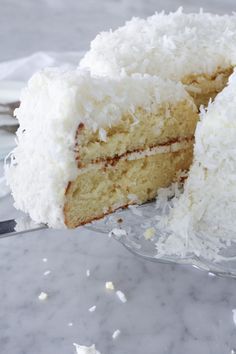 a close up of a cake on a plate with a slice taken out of it