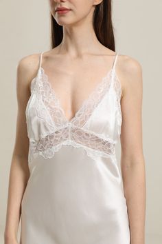 100% Mulberry Silk Breathable & Lightweight Lightweight & Comfortable Type: Lace Flower Camisole NightwearMaterial: 19Momme Charmeuse Silk Features: Satin, wear-resistant and stylish.Details: Silk nightgown offers you a better sleeping experience. This nightgown with lovely flower lace around the neckline and cloth end will give you a new sleeping experience. White lace offers you a pure feeling and realizes the dream of becoming a princess. Black Lace will make you a sexy, charming woman. Daisy Fitted V-neck Sleepwear For Wedding Night, Fitted Delicate Lace Nightgown For Sleep, Satin Sleepwear With Delicate Lace For Loungewear, Sleeveless Nightgown With Delicate Lace For Loungewear, Sleeveless Delicate Lace Nightgown For Loungewear, Delicate Lace Satin Sleepwear For Loungewear, Lace Camisole Nightgown For Bedtime, White V-neck Chemise For Sleep, Sleeveless Bias Cut Sleepwear