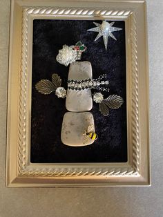 a cake with flowers and stars on it in a silver frame