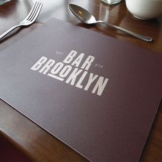 a place mat with the words bar brooklyn on it