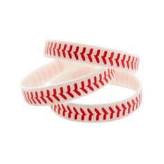 two baseball bracelets with red stitching on them