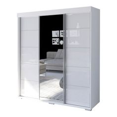 an image of a white closet with glass doors