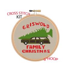 cross stitch kit with the words griswod family christmas and a green car