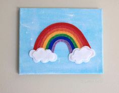 a painting of a rainbow with clouds painted on it