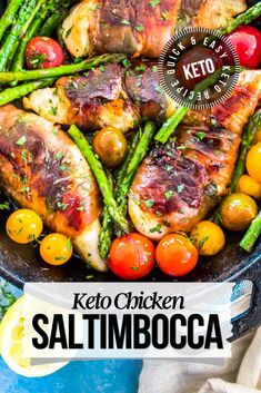 keto chicken with asparagus and tomatoes in a cast iron skillet