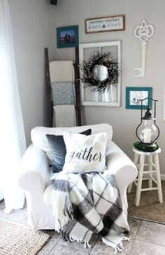 a living room with a white chair and pictures on the wall above it that says gather