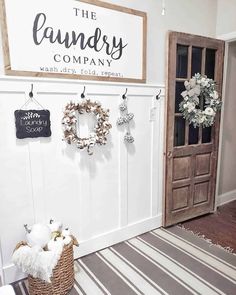 the laundry company is located in an empty room with wreaths hanging on the wall