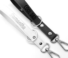 two black and white lanyards with the words amazon printed on them, one for dogs