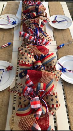 the table is decorated with red, white and blue ribbons