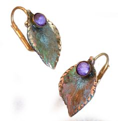 PRICES MAY VARY. Olive Patina Solid Brass Sculptural Leaf Earrings - Chariote Lightweight Earrings are .5 inch wide x .75inch high 24k Gold Plated Museum Latches (Leverbacks) Includes Artist's Bio and Designer Velvet Pouch with Trademark Tag Genuine Charoite Semi-precious Stones Delicate Leaf Earrings in our exclusive Verdigris Patina Solid Brass with genuine Charoite Cabochons. 
Gold Plated Brass Museum Latch (leverback) closures.
 Each Earring measures: .5 inch x .75 inch.
All Elaine Coyne Art Pmc Earrings, Olive Earrings, Lightweight Earrings, Purple Stones, Bar Earrings, Light Weight Earrings, Leaf Earrings, Wire Jewelry, Clay Earrings