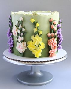 a cake decorated with flowers on a plate