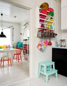 the kitchen is decorated in bright colors