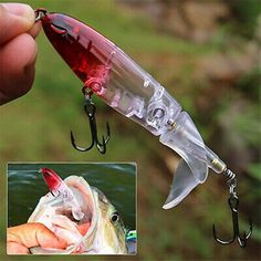 a person holding a fishing lure in their hand