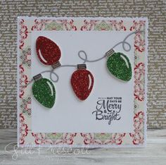 a christmas card with glittered ornaments hanging from it's sides and the words merry bright