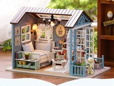 a miniature doll house with furniture and accessories