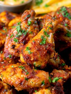 chicken wings with sauce and parsley on top