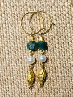 Ancient Roman style earrings with genuine pearls and emerald, ruby or sapphire rough beads The design of these earrings is based on an extant emerald, pearl and gold earring from about the 2nd century CE as shown in the last photo of the catalog for this listing. these earrings are the perfect finish for your Roman lady's persona! Please convo me if a custom order of different beads or sterling silver is desired, I love working with customers on designs! These earrings are shown on hoops but can Gold Pearl Drop Earrings For May Birthstone, Gold Dangle Pearl Earrings With Natural Stones, Gold Byzantine Handmade Earrings, Luxury Byzantine Handmade Earrings, Etruscan Jewelry Earrings, Ancient Roman Earrings, Greek Earrings Ancient, Roman Style, Earrings Emerald