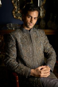 This set features tonal embroidered in thread and metallic beads. It is paired with tonal silk kurta and matching raw silk straight pants. Complimenting footwear is also available. DELIVERY TIMEPlease allow 8-12 weeks for your outfit to arrive. FABRIC DETAILSSherwani- Raw Silk, Kurta - Silk, Trouser - Raw Silk Professional cleaning only. Grey Sherwani, Raw Silk Kurta, Seema Gujral, Wedding Dresses Men Indian, Wedding Dress Men, Silk Kurta, Tarun Tahiliani, Vogue India, Sequin Embroidery