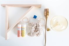 the items needed to make this diy lamp are laid out on a white surface