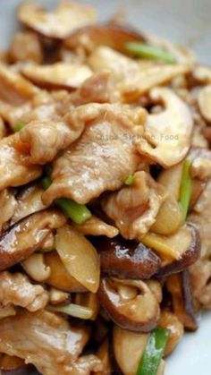 chicken and mushroom stir fry on a white plate