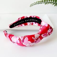 ∙ Red and pink floral print∙ 1 1/2" knot and 2 1/2" side width∙ 1" comfort fit width band This beautiful red and pink summer floral knotted silk headband is the perfect accessory to add a touch of elegance and comfort to any outfit. The lightweight and silky soft material gently rests on your head, providing a cozy and comfortable fit all day long. The delicate floral print adds a touch of feminine charm, while the knotted design at the top adds a touch of bohemian chic. The headband is perfect Pink Summer Headband, Red Hair Accessories For Spring Gift, Trendy Pink Hair Accessories For Summer, Red Spring Headband, Adjustable Red Headband For Spring, Red Headband For Spring, Red Headband Hair Accessories For Spring, Red Summer Headband As A Gift, Red Summer Headband For Gift