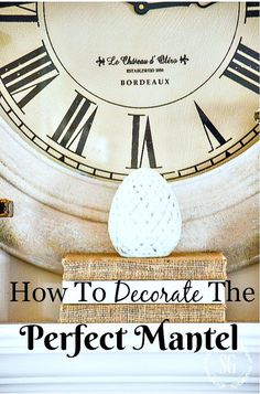 a clock with the words how to decorate the perfect mantel on top of it