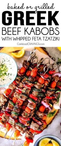 greek beef kabobs with whipped feta taziki on a platter