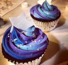 two cupcakes with blue and purple icing on them are displayed in an instagram