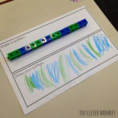 two pencils sitting on top of a piece of paper next to some writing materials