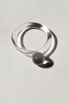 Clear Handmade pyrex glass ring with clear band and small clear orb ball. About Jane D'Arensbourg"Light, shadow, and pattern are some of the themes I explore in my work. Glass is a material I use as a vehicle to capture light, energy, and fragility. There is a time in the day in my studio when the sun pours in and everything comes to life as sunlight slowly travels around my studio, casting beams of light through all of the glass sculptures, jewelry, lighting, and experiments. I often have to dr Meditation Artwork, Beams Of Light, Dot Ring, Funky Decor, Light Shadow, Sculptural Object, Glass Ring, Light Energy, Pyrex Glass