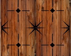 an image of a wooden door with black crosses on it's woodgrain