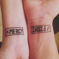 two people with matching tattoos on their wrists that say merry and'x '