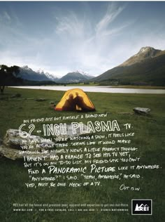 a yellow tent sitting on top of a lush green field next to a mountain range