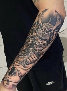 a man with a tattoo on his arm